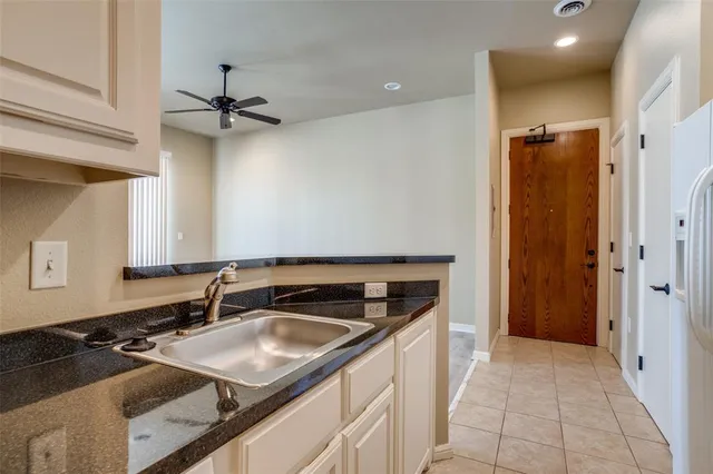 a kitchen that has a sink and a stove
