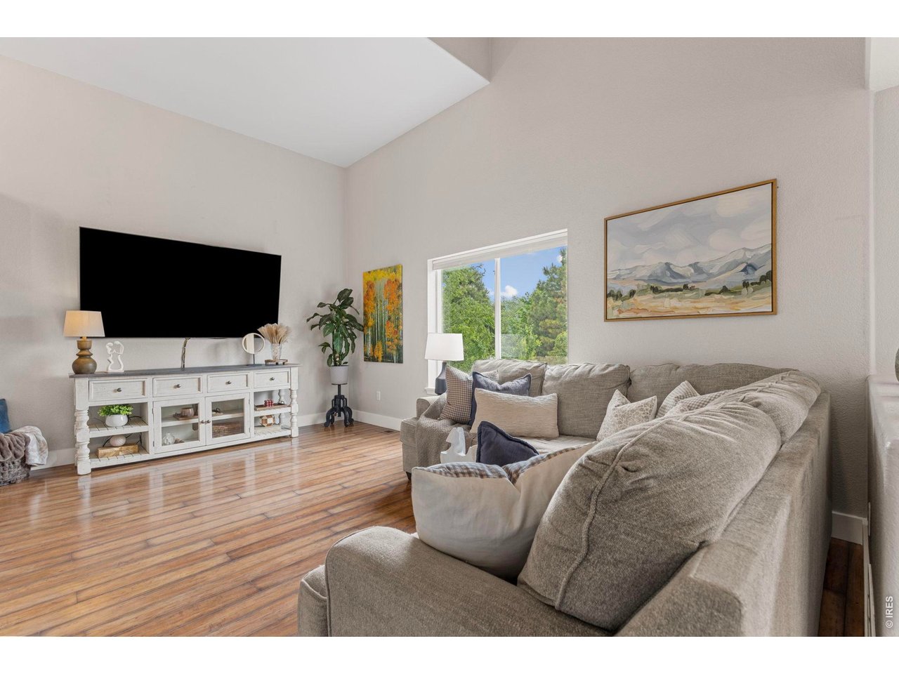 6531 St Vrain Ranch Boulevard Firestone, CO 80504 - Photo 8 of 30 a living room with furniture and a flat screen tv