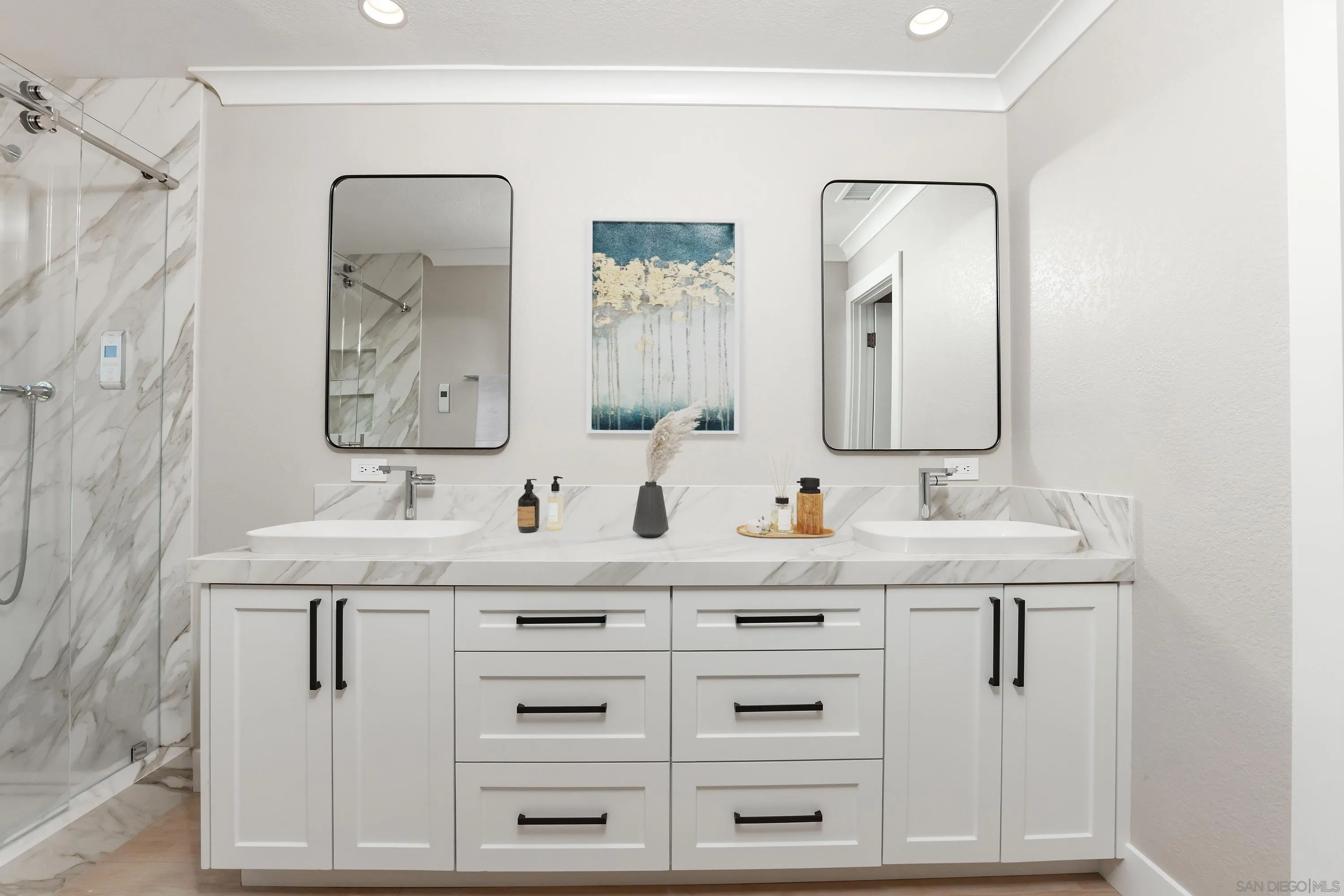 2102 Wandering Road Encinitas, CA 92024 - Photo 18 of 37 a bathroom with double sink and a mirror