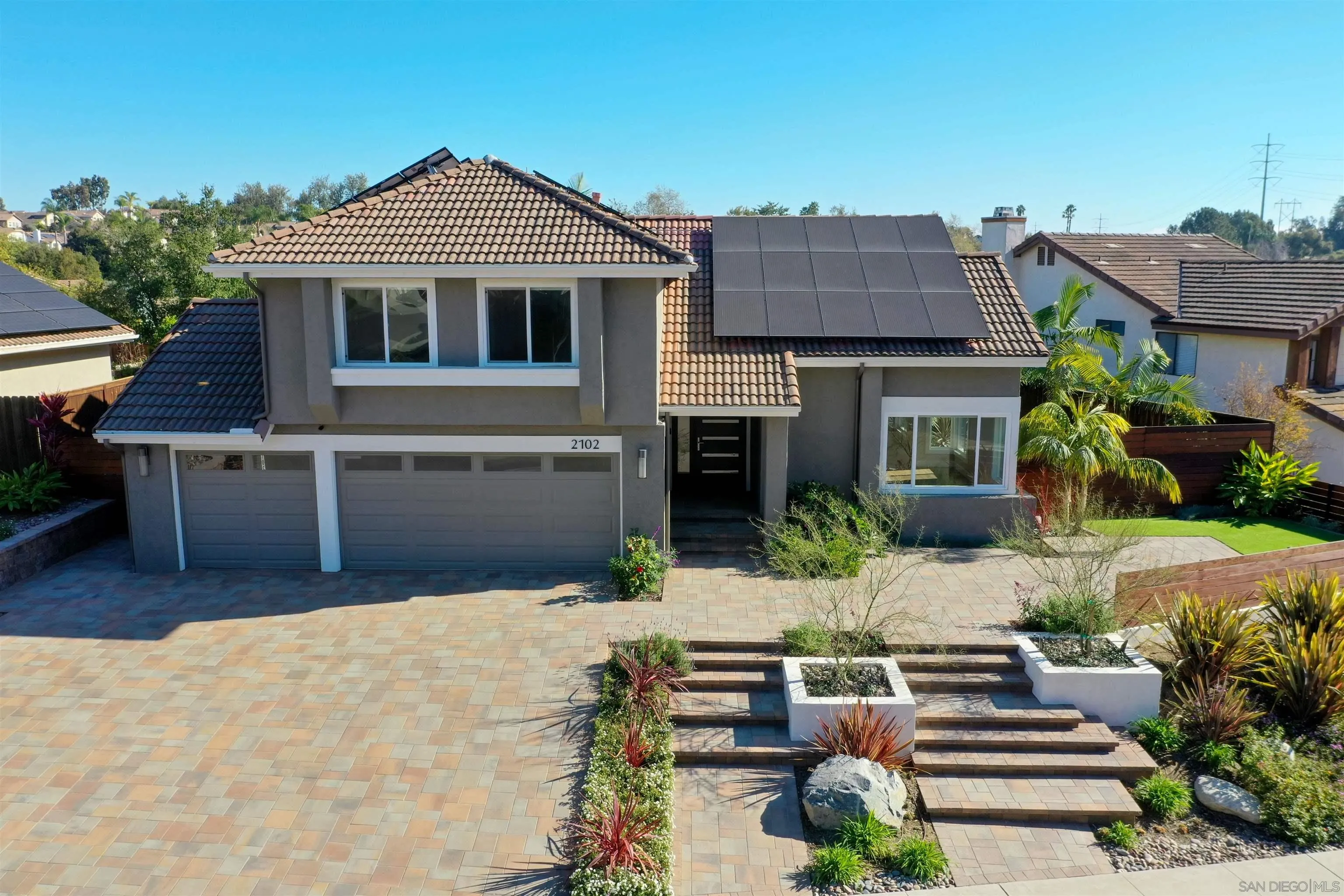 2102 Wandering Road Encinitas, CA 92024 - Photo 2 of 37 a front view of a house with garden