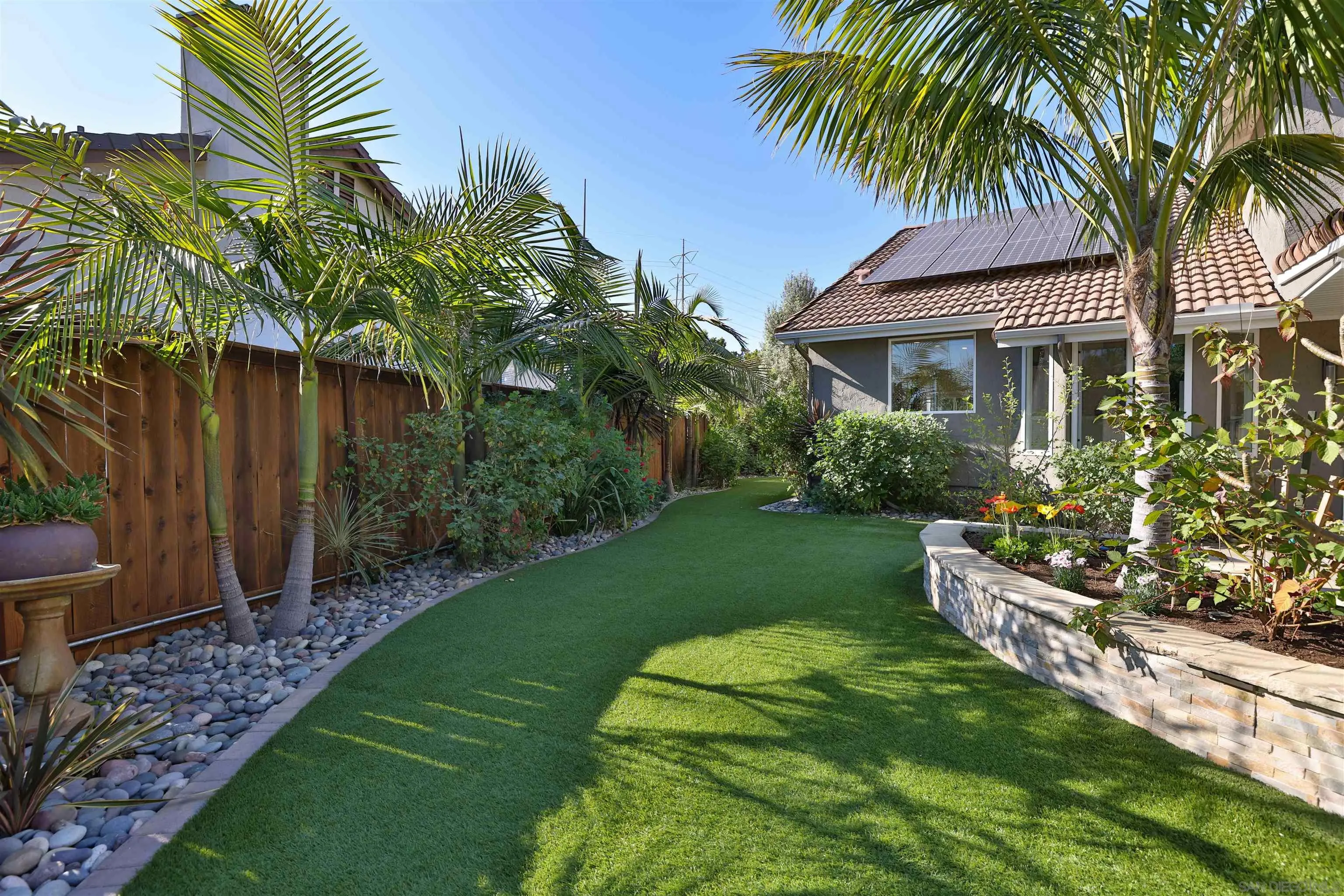 2102 Wandering Road Encinitas, CA 92024 - Photo 29 of 37 a front view of a house with a garden