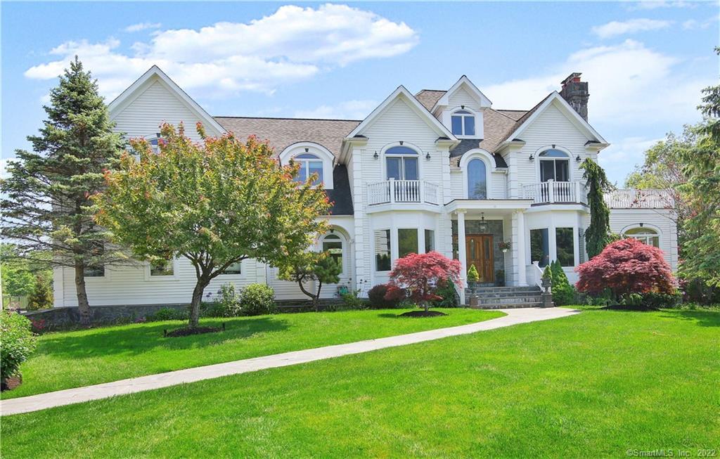 11 Kendra Court Ridgefield, CT 06877 - Photo 1 of 1 a front view of building with yard and green space