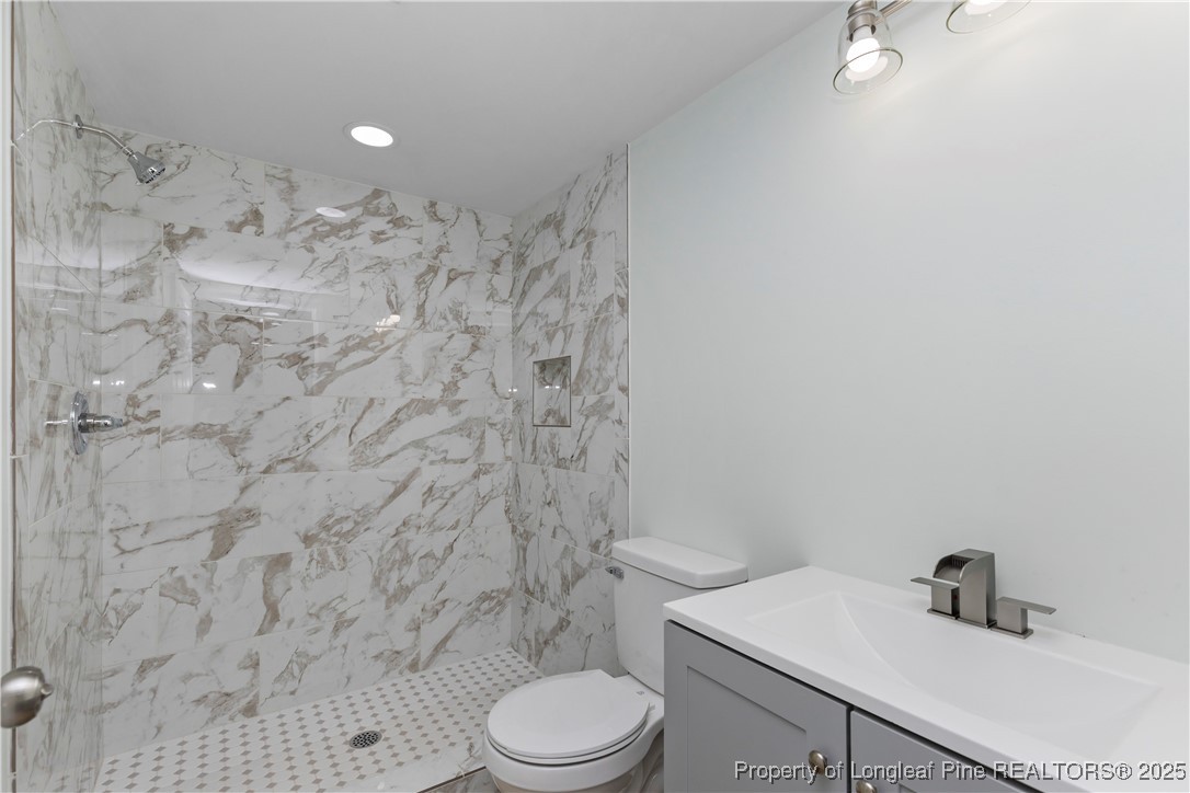 1340 George Perry Lee Road Dunn, NC 28334 - Photo 28 of 31 a bathroom with a sink toilet and shower