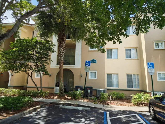 a front view of a house with street