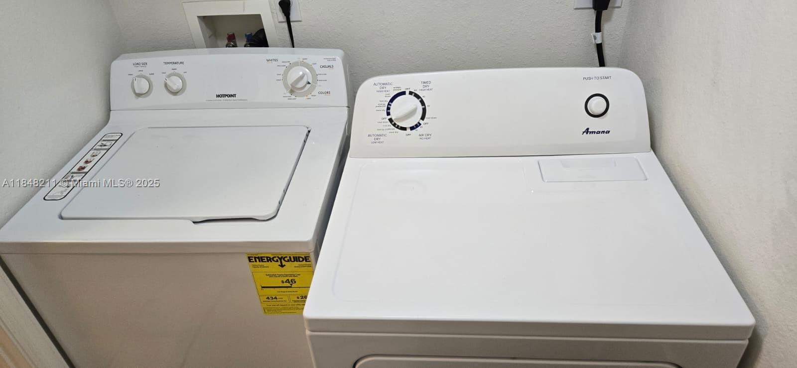 2586 Centergate Drive, Unit 307 Miramar, FL 33025 - Photo 23 of 43 a utility room with dryer and washer