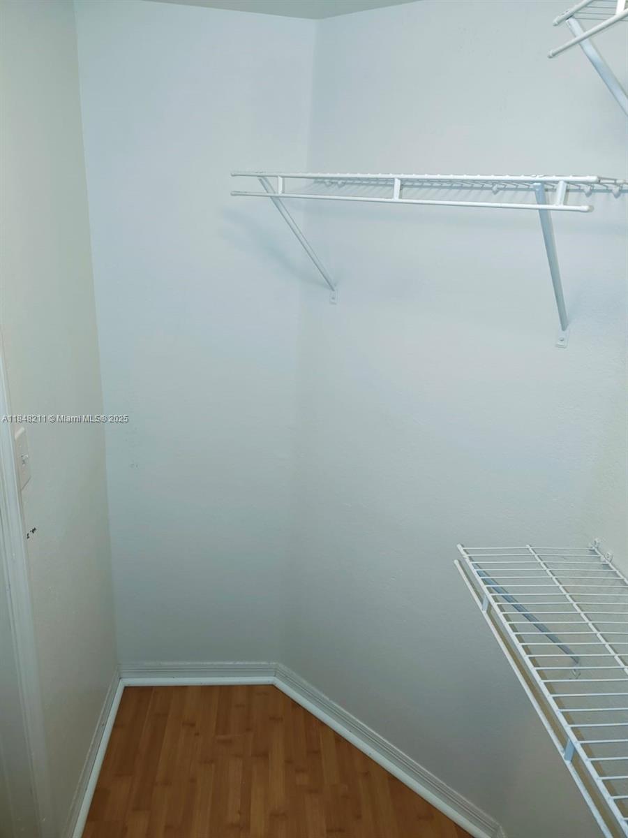 2586 Centergate Drive, Unit 307 Miramar, FL 33025 - Photo 28 of 43 a view of small space with racks on the wall