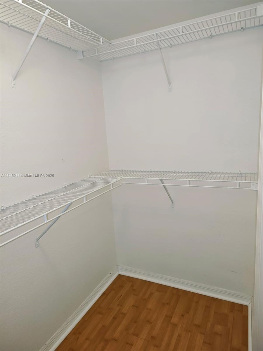 2586 Centergate Drive, Unit 307 Miramar, FL 33025 - Photo 30 of 43 a view of a room with racks on the wall