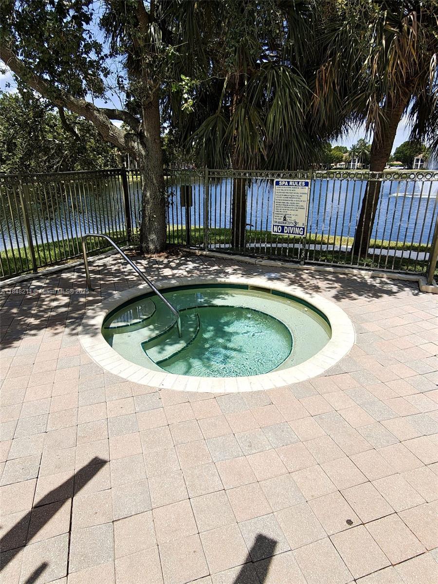 2586 Centergate Drive, Unit 307 Miramar, FL 33025 - Photo 36 of 43 a view of swimming pool with patio