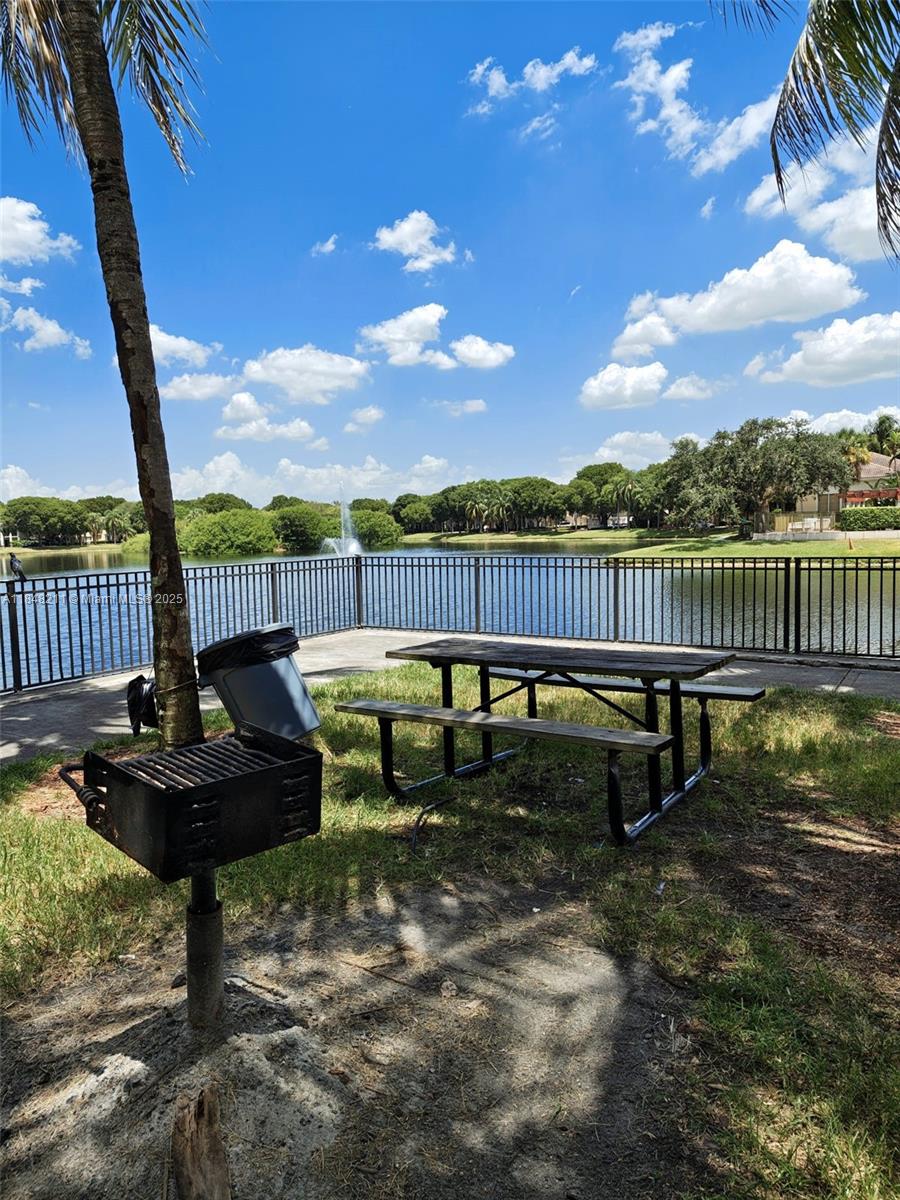 2586 Centergate Drive, Unit 307 Miramar, FL 33025 - Photo 37 of 43 a view of a garden with sitting area