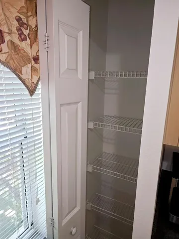 a bathroom with a glass door shower
