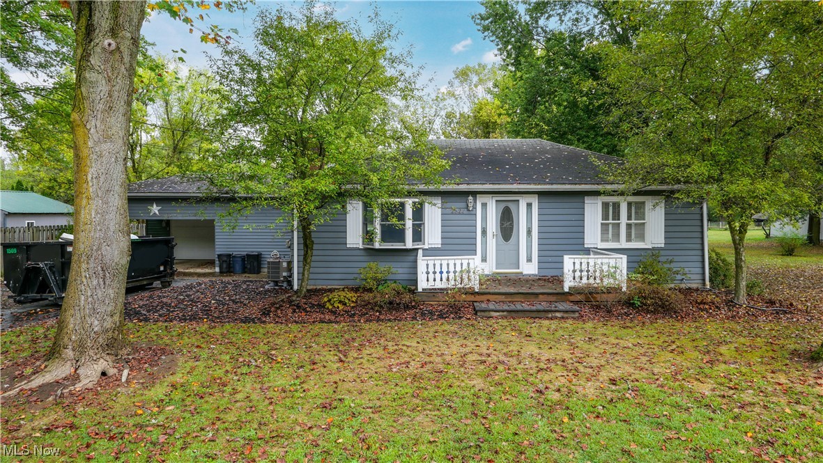 2822 Selkirk Bush Road Warren, OH 44481 - Photo 2 of 50 View of front of property featuring a front yard and roof with shingles