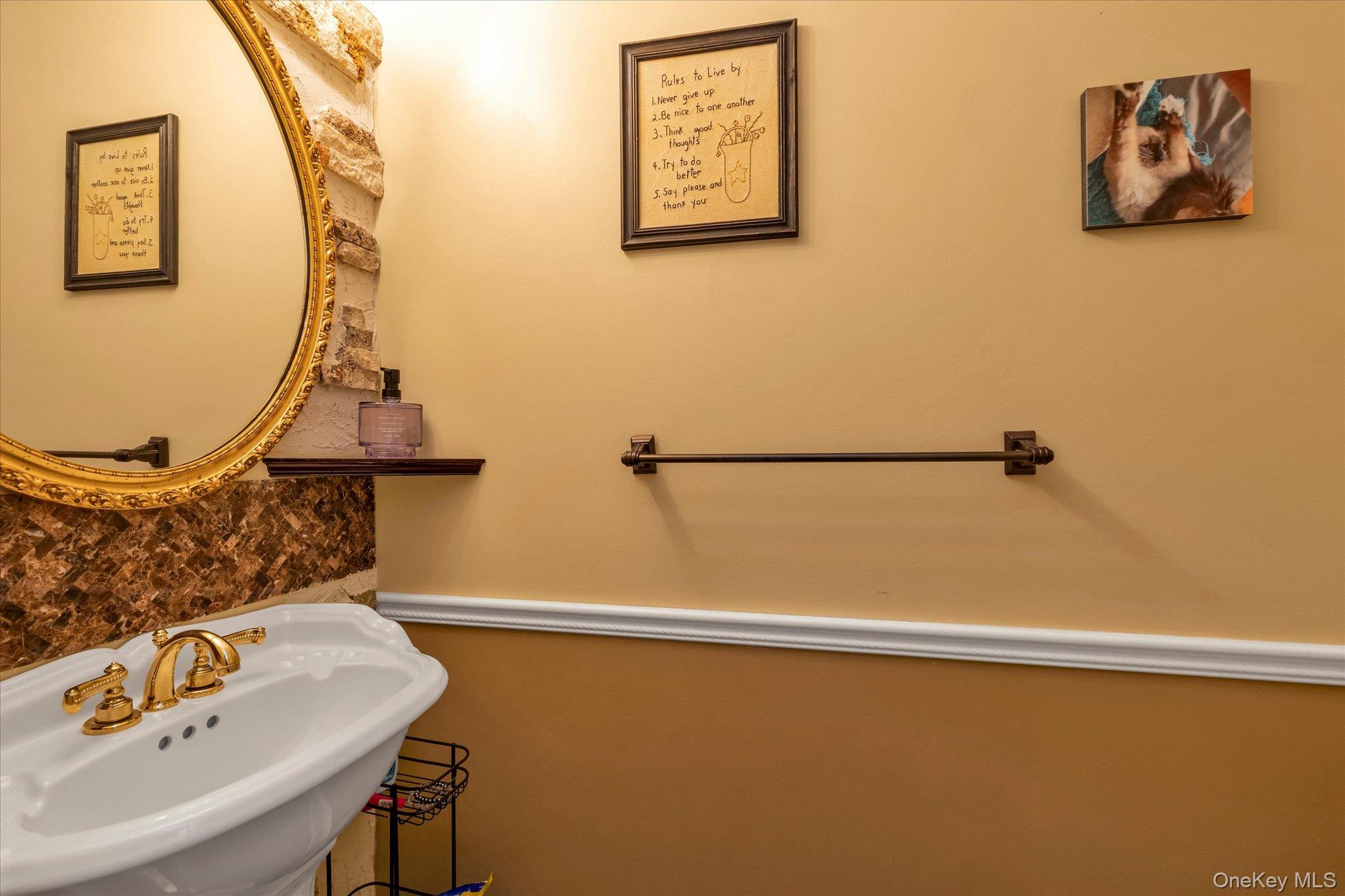 150 I U Willets Road Albertson, NY 11507 - Photo 8 of 21 Powder room with pedestal sink featuring a gold-toned faucet with dual handles