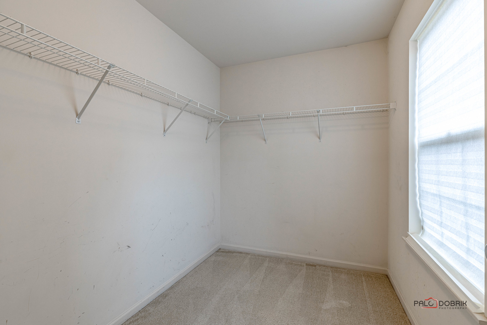 260 Comstock Drive, Unit 260 Elgin, IL 60124 - Photo 22 of 30 a view of a room with racks on the wall