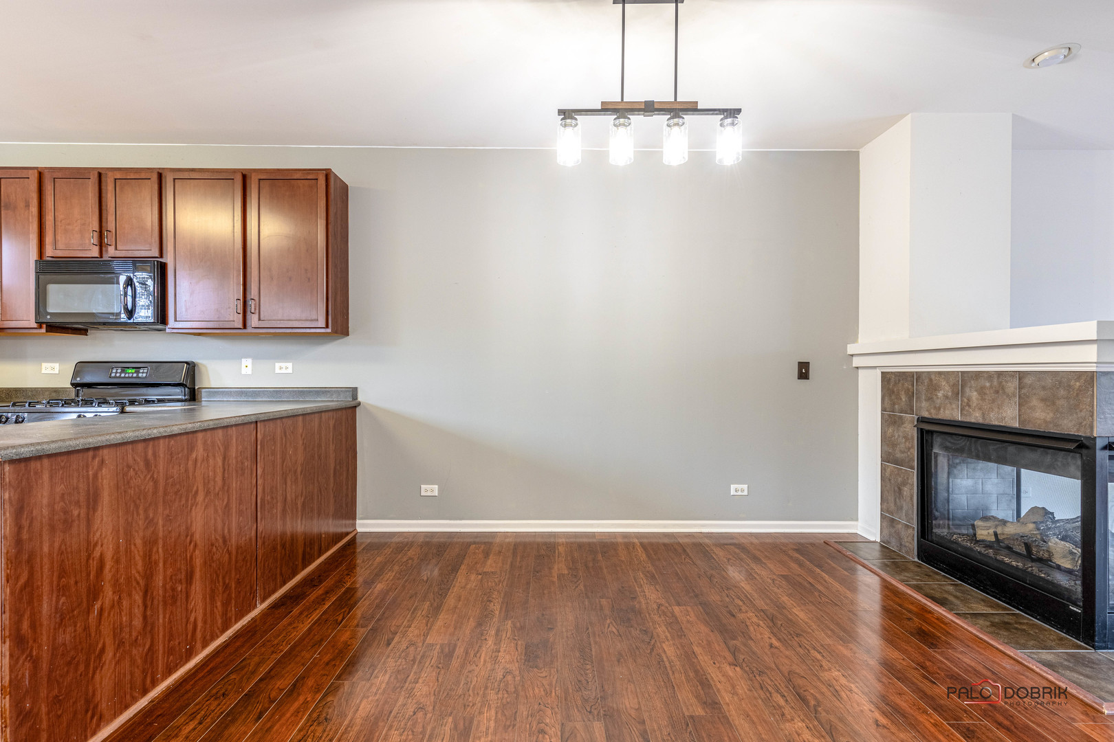 260 Comstock Drive, Unit 260 Elgin, IL 60124 - Photo 7 of 30 a view of kitchen with granite countertop stove top oven and cabinets