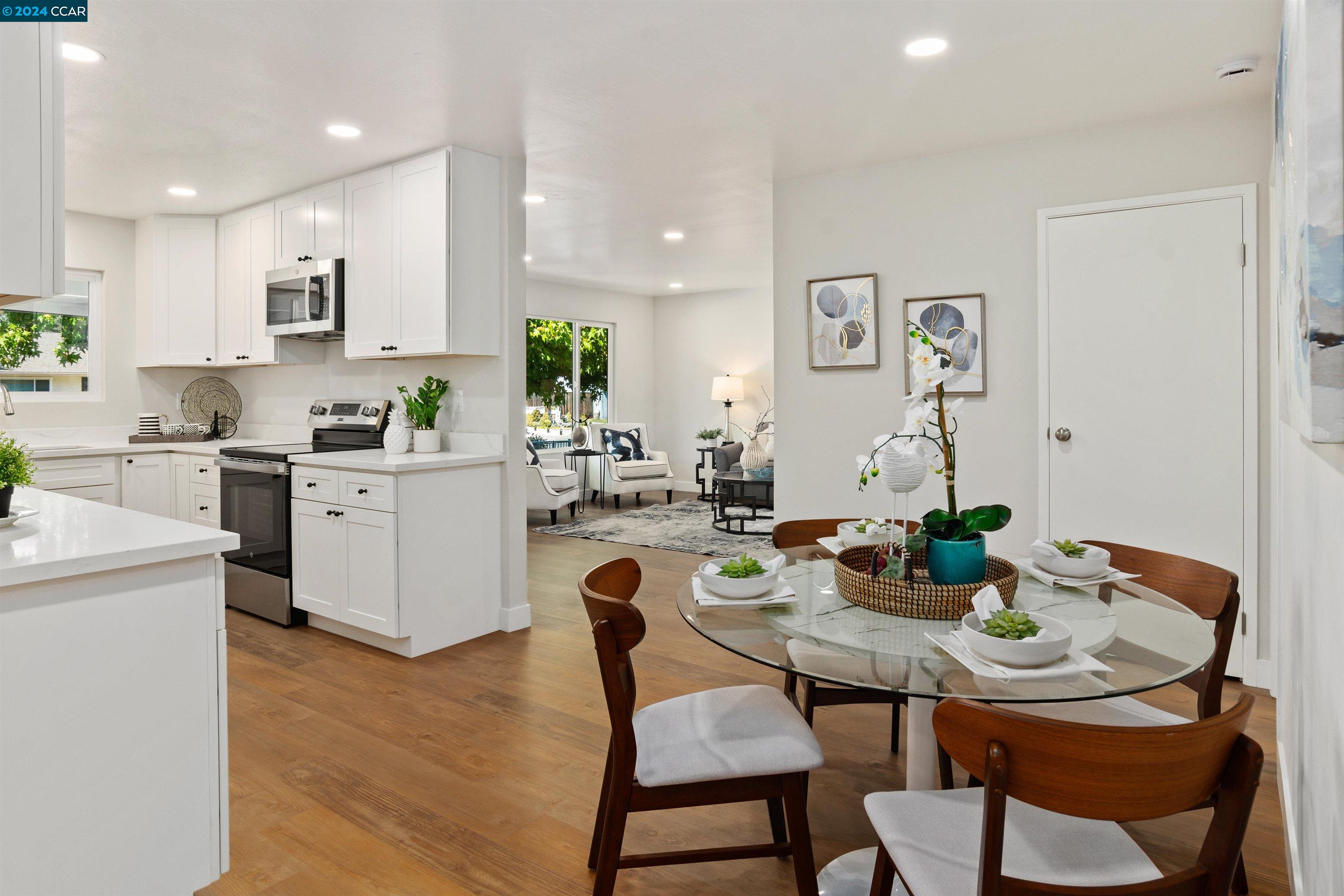 Pine Valley Road San Ramon, CA 94583 - Photo 11 of 34 a view of a dining room with furniture and wooden floor