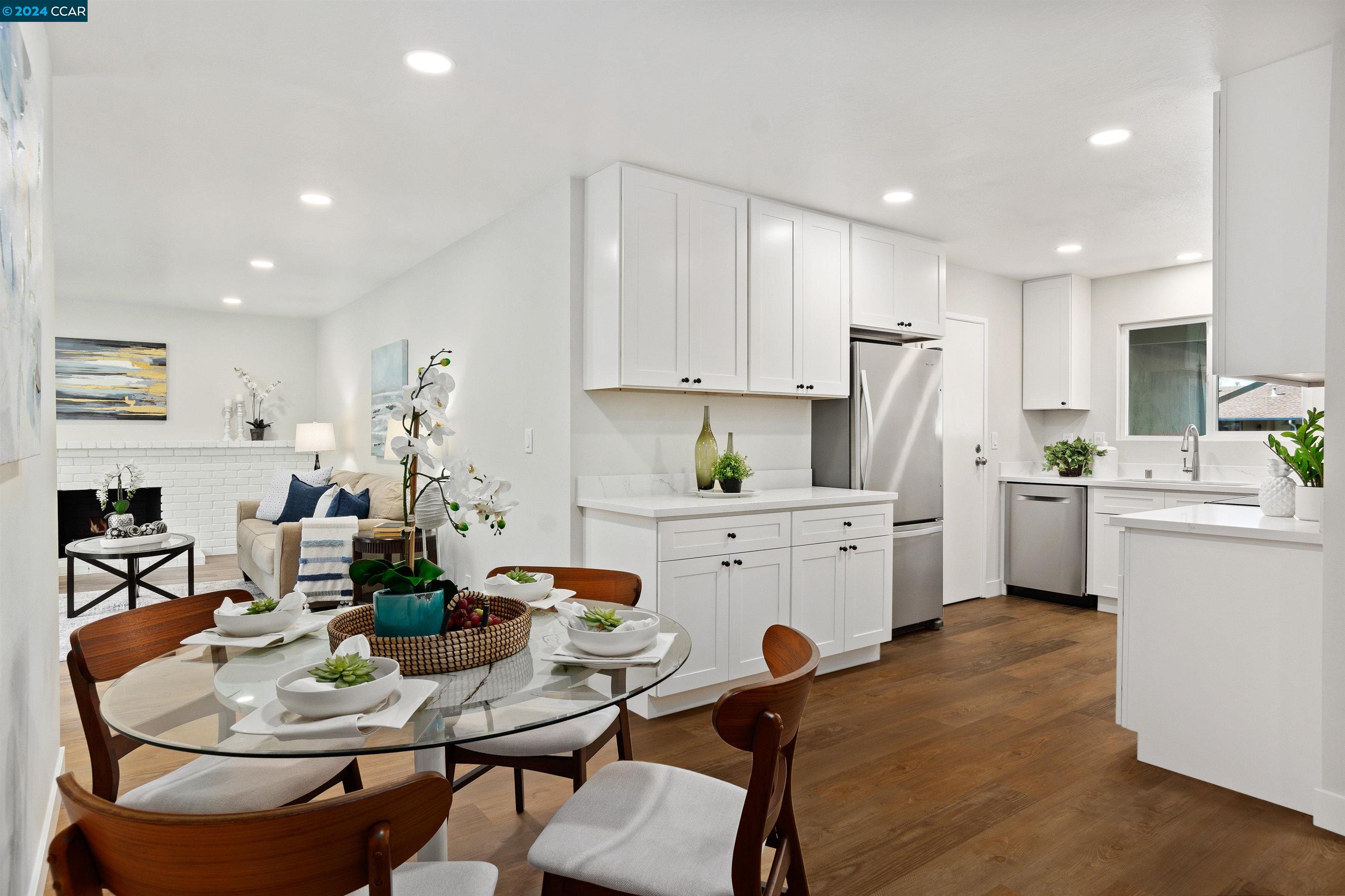 Pine Valley Road San Ramon, CA 94583 - Photo 12 of 34 a kitchen with white cabinets and white appliances