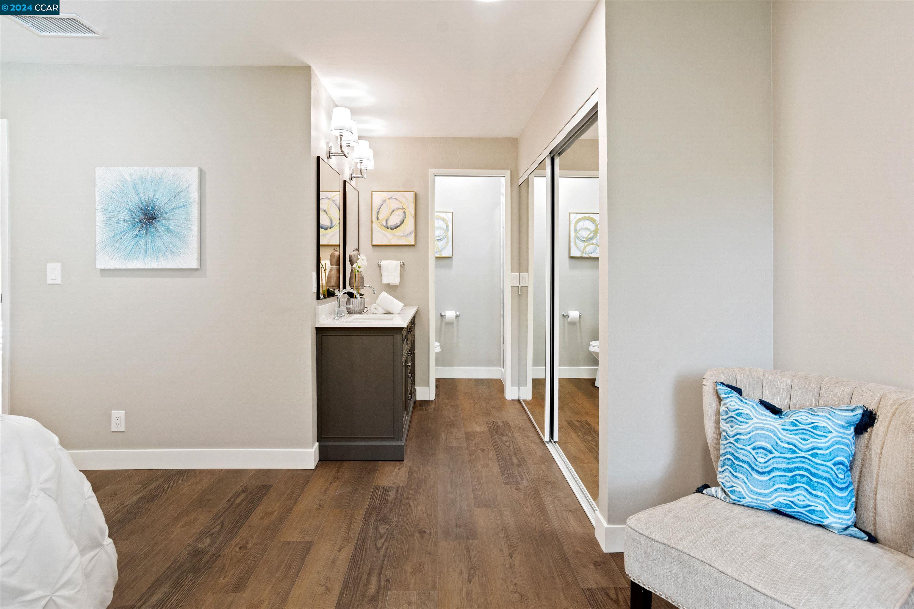 Pine Valley Road San Ramon, CA 94583 - Photo 21 of 34 a view of a hallway with wooden floor and cabinet