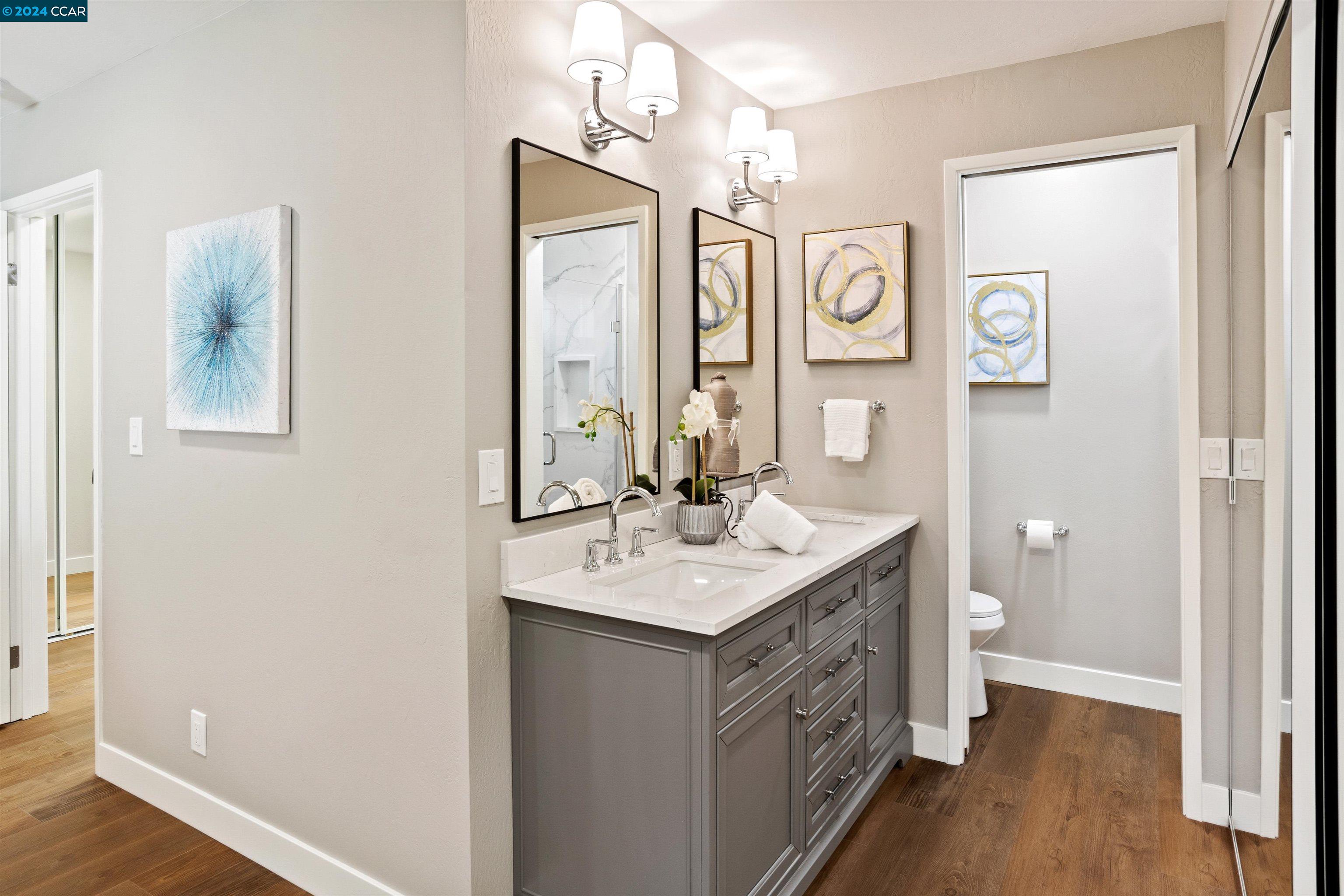 Pine Valley Road San Ramon, CA 94583 - Photo 22 of 34 a spacious bathroom with a double vanity sink toilet and a mirror