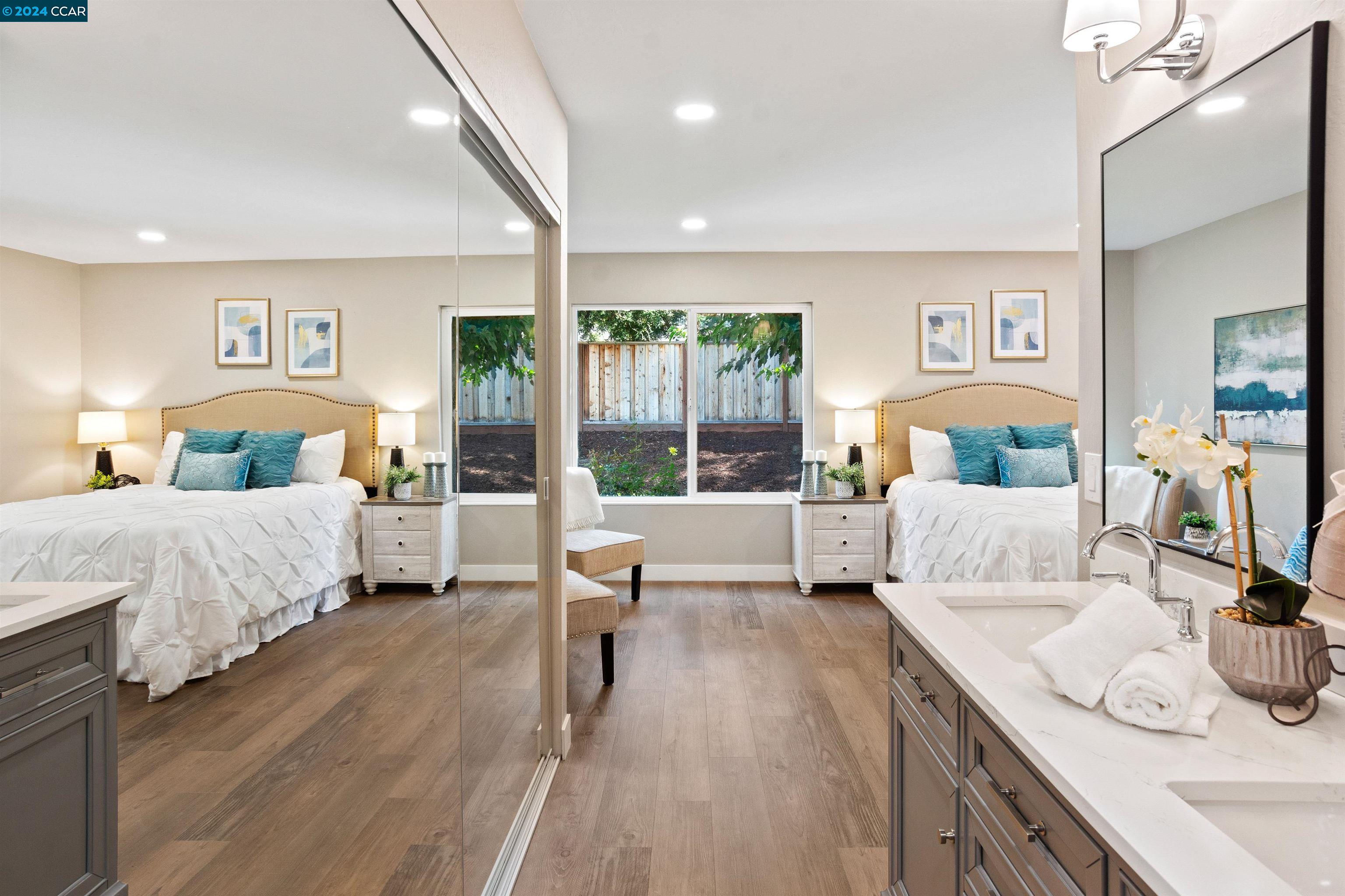 Pine Valley Road San Ramon, CA 94583 - Photo 23 of 34 a bedroom with a large bed and a couch