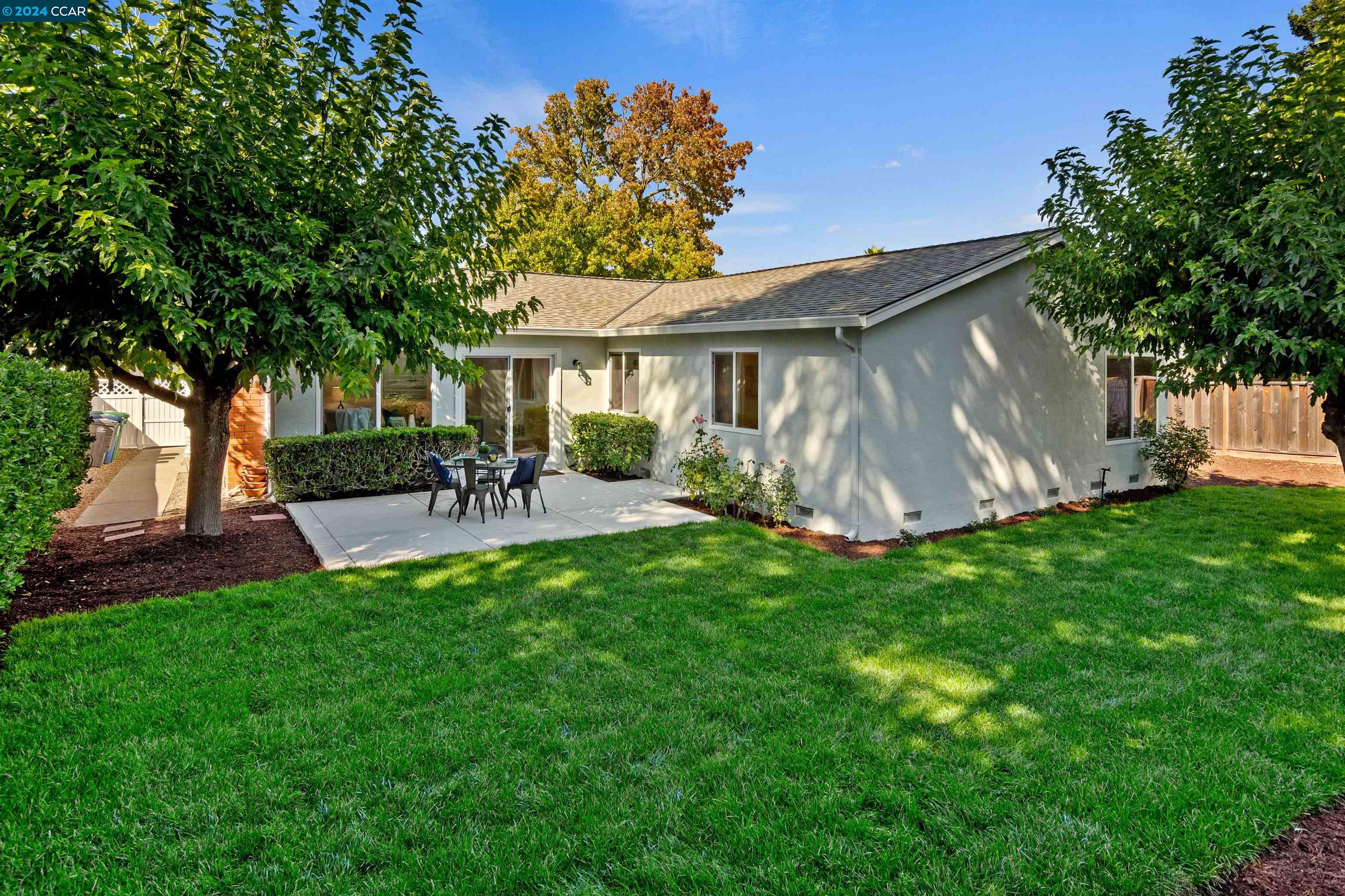 Pine Valley Road San Ramon, CA 94583 - Photo 27 of 34 a front view of house with a garden and patio