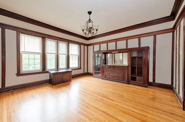 a view of livingroom with furniture wooden floor and windows