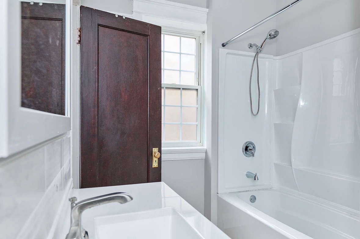 5436 West Ferdinand Street, Unit 3E Chicago, IL 60644 - Photo 13 of 16 a bathroom with a bathtub and shower