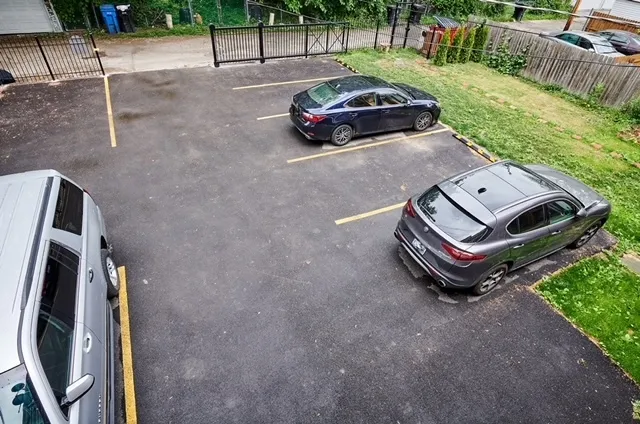 a car parked in front of a yard