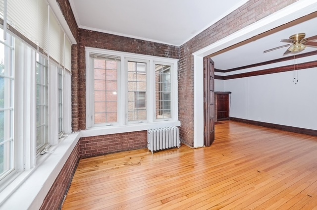 5436 West Ferdinand Street, Unit 3E Chicago, IL 60644 - Photo 2 of 16 a view of front door of house with wooden floor