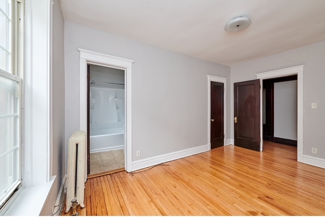 5436 West Ferdinand Street, Unit 3E Chicago, IL 60644 - Photo 5 of 16 a view of empty room with wooden floor