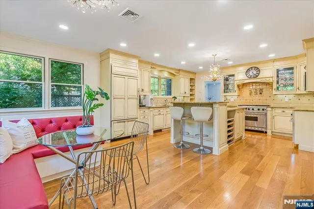 a living room with lots of furniture and a large window