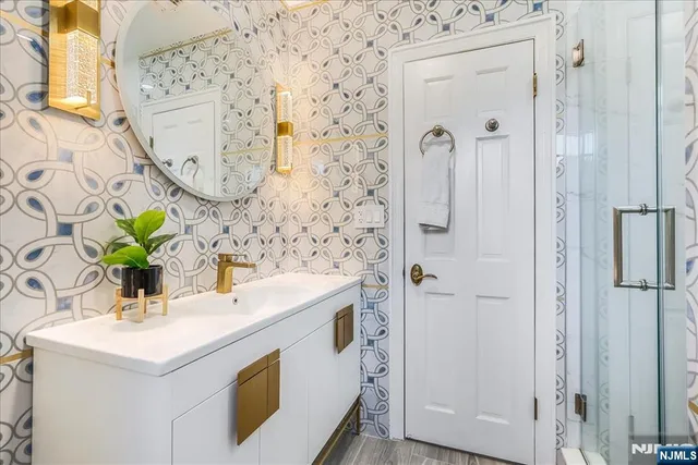 a bathroom with a sink and a mirror