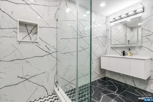 a bathroom with a sink and mirror