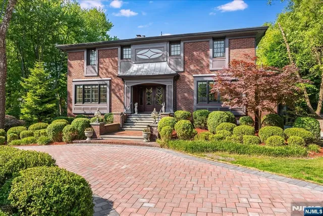 a front view of a house with a yard outdoor seating and entertaining space