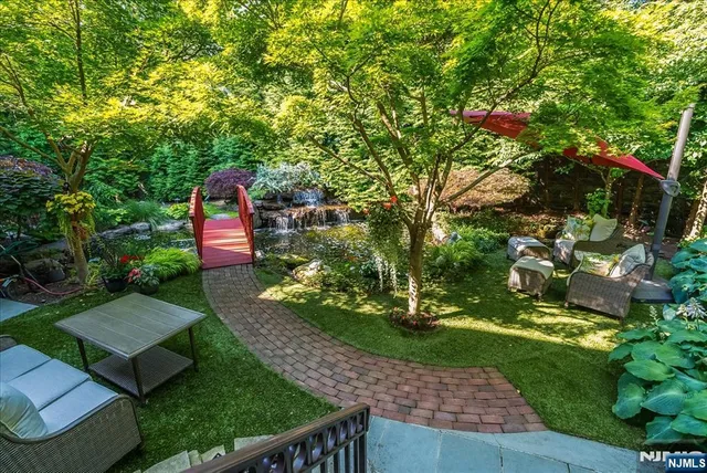 a view of a backyard with sitting area