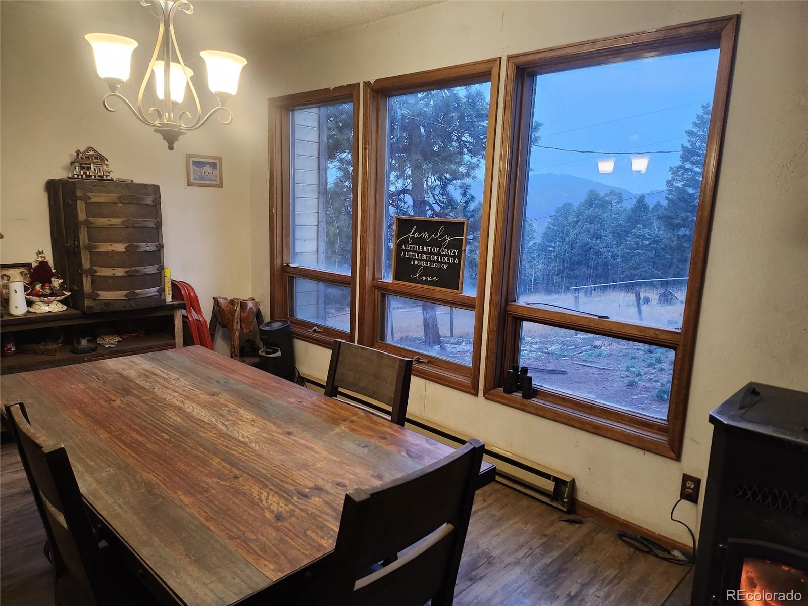 13108 Elsie Road Conifer, CO 80433 - Photo 8 of 49 a room with pool table and windows
