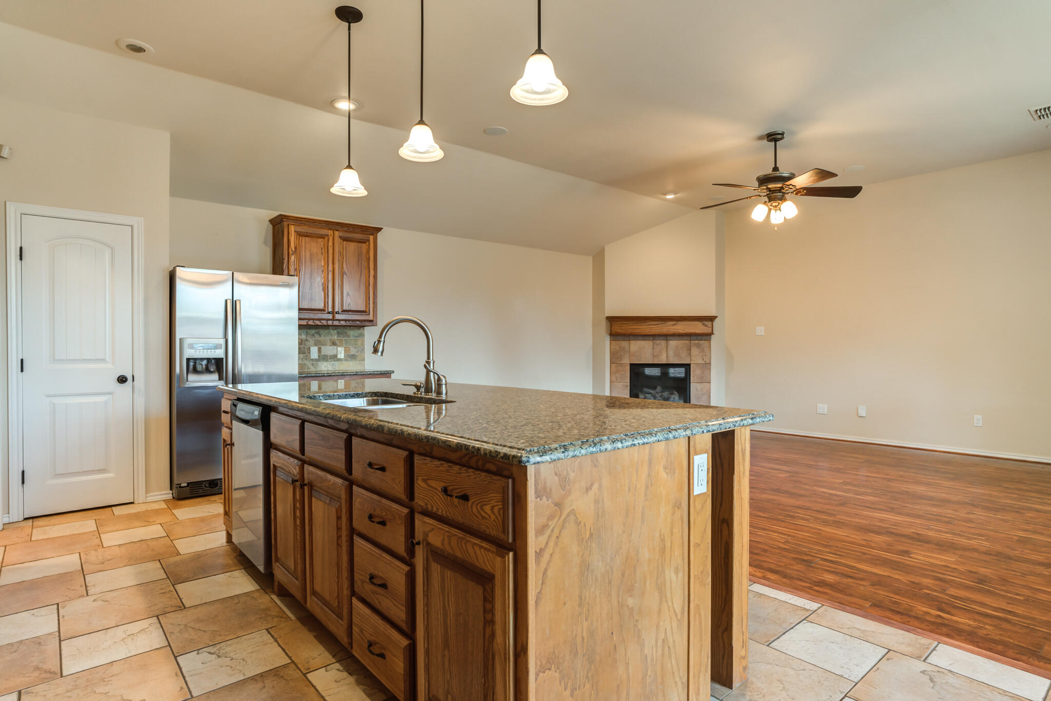 4802 Amherst Street Lubbock, TX 79416 - Photo 13 of 33 a kitchen with a sink a stove and refrigerator