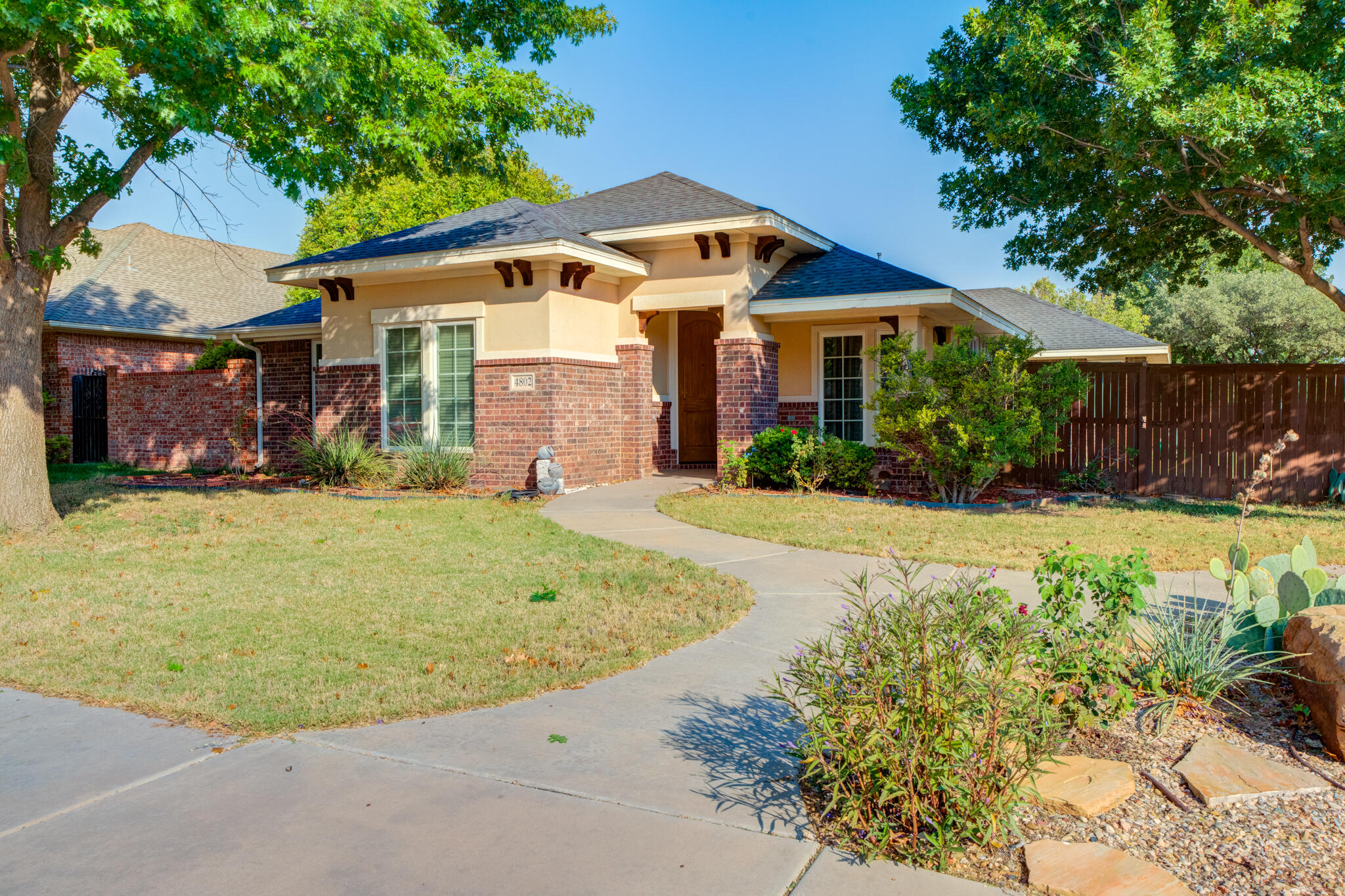 4802 Amherst Street Lubbock, TX 79416 - Photo 2 of 33 a front view of a house with a yard