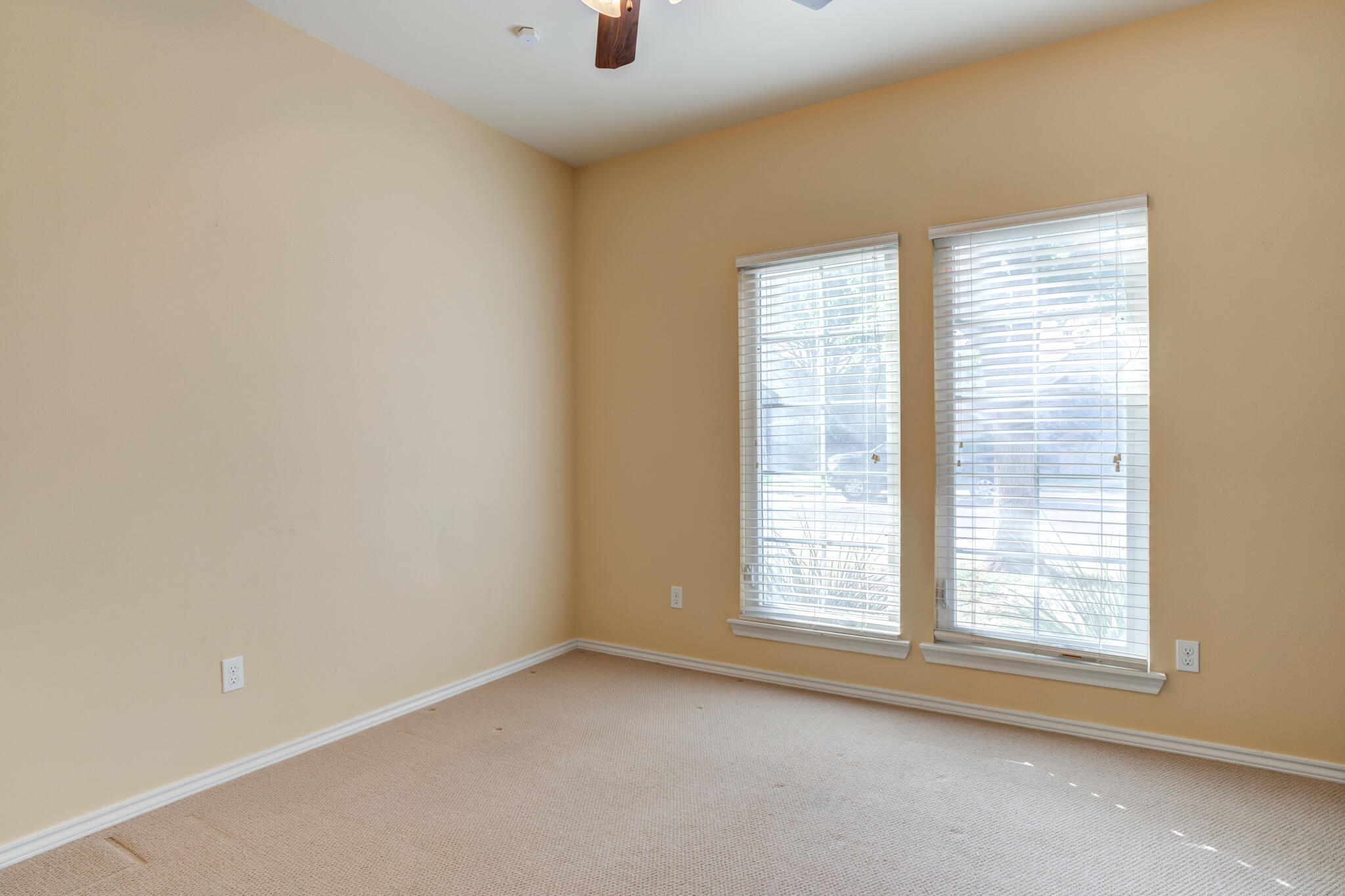 4802 Amherst Street Lubbock, TX 79416 - Photo 21 of 33 a view of an empty room with a window