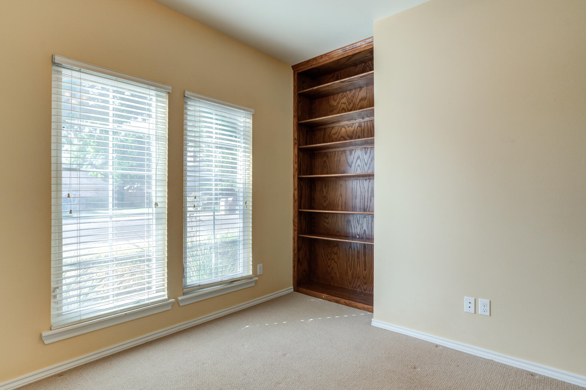 4802 Amherst Street Lubbock, TX 79416 - Photo 22 of 33 a view of wooden floor and window in a room