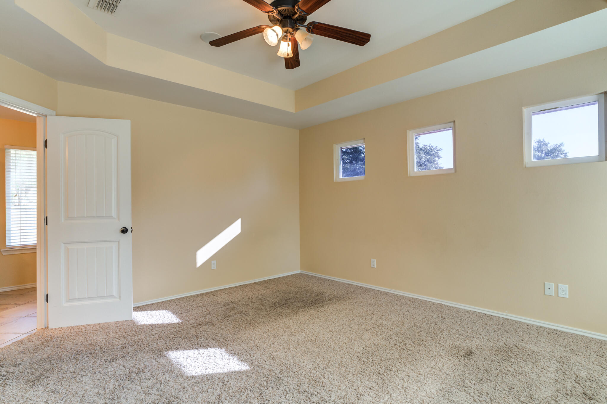 4802 Amherst Street Lubbock, TX 79416 - Photo 24 of 33 a view of an empty room with window and chandelier fan