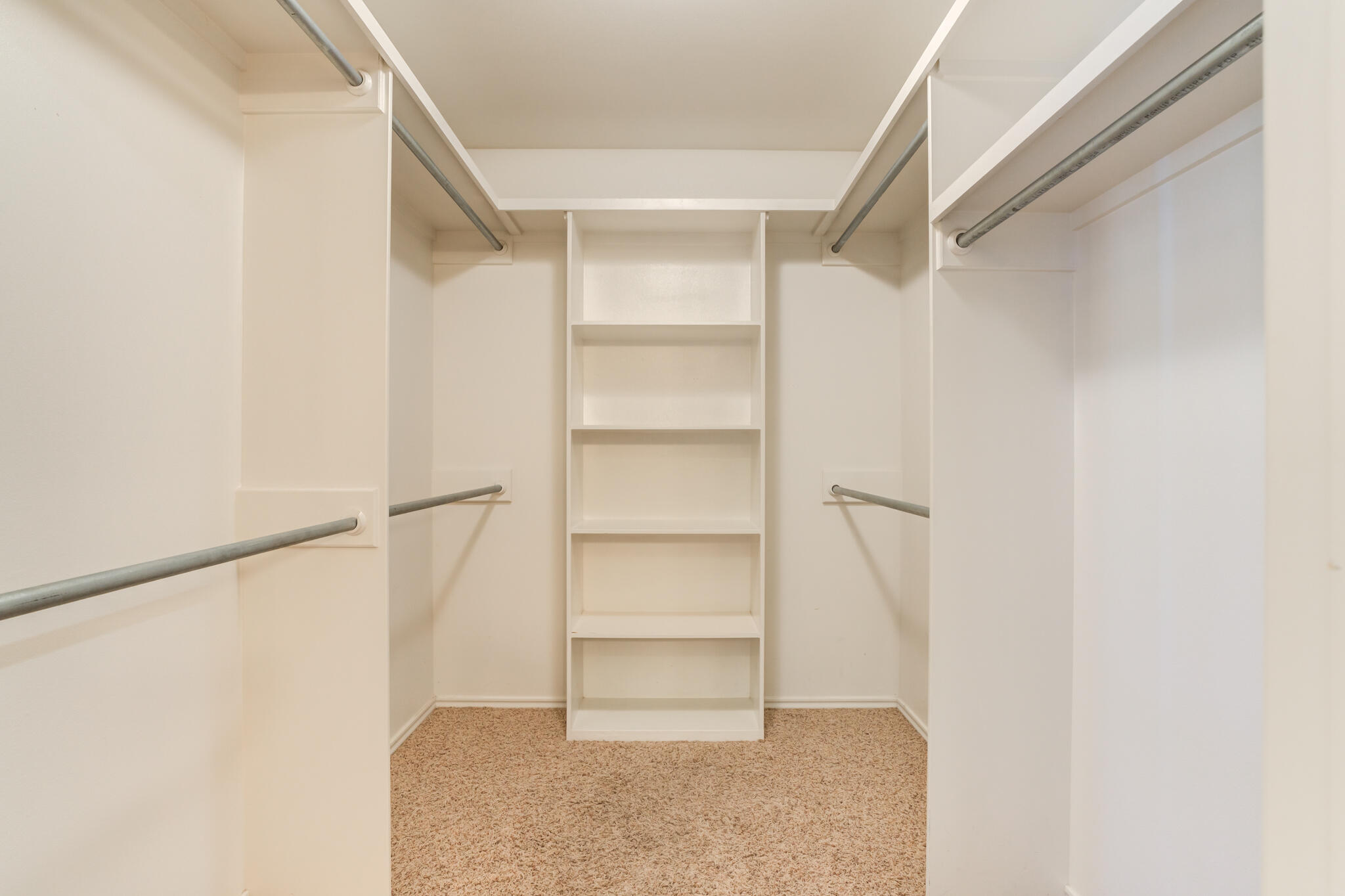 4802 Amherst Street Lubbock, TX 79416 - Photo 28 of 33 a view of walk in closet with empty racks
