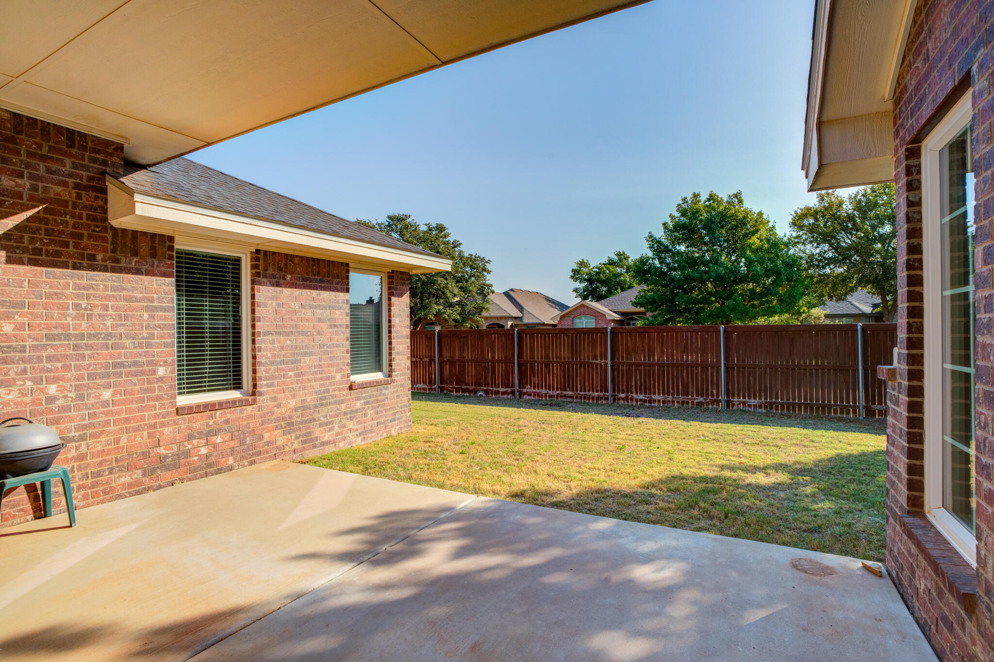 4802 Amherst Street Lubbock, TX 79416 - Photo 30 of 33 a swimming pool with wooden fence