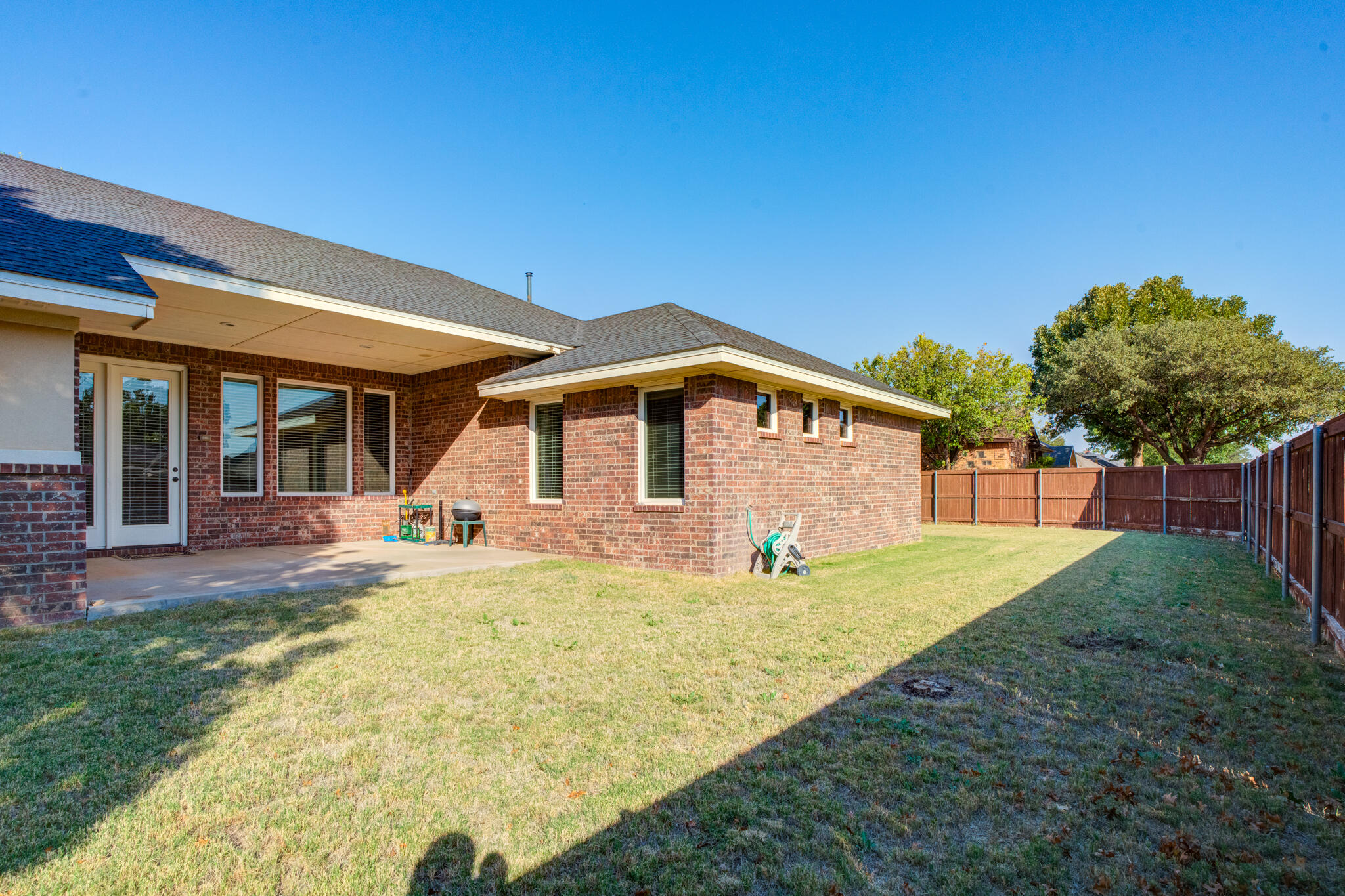 4802 Amherst Street Lubbock, TX 79416 - Photo 31 of 33 a view of a house with backyard and porch