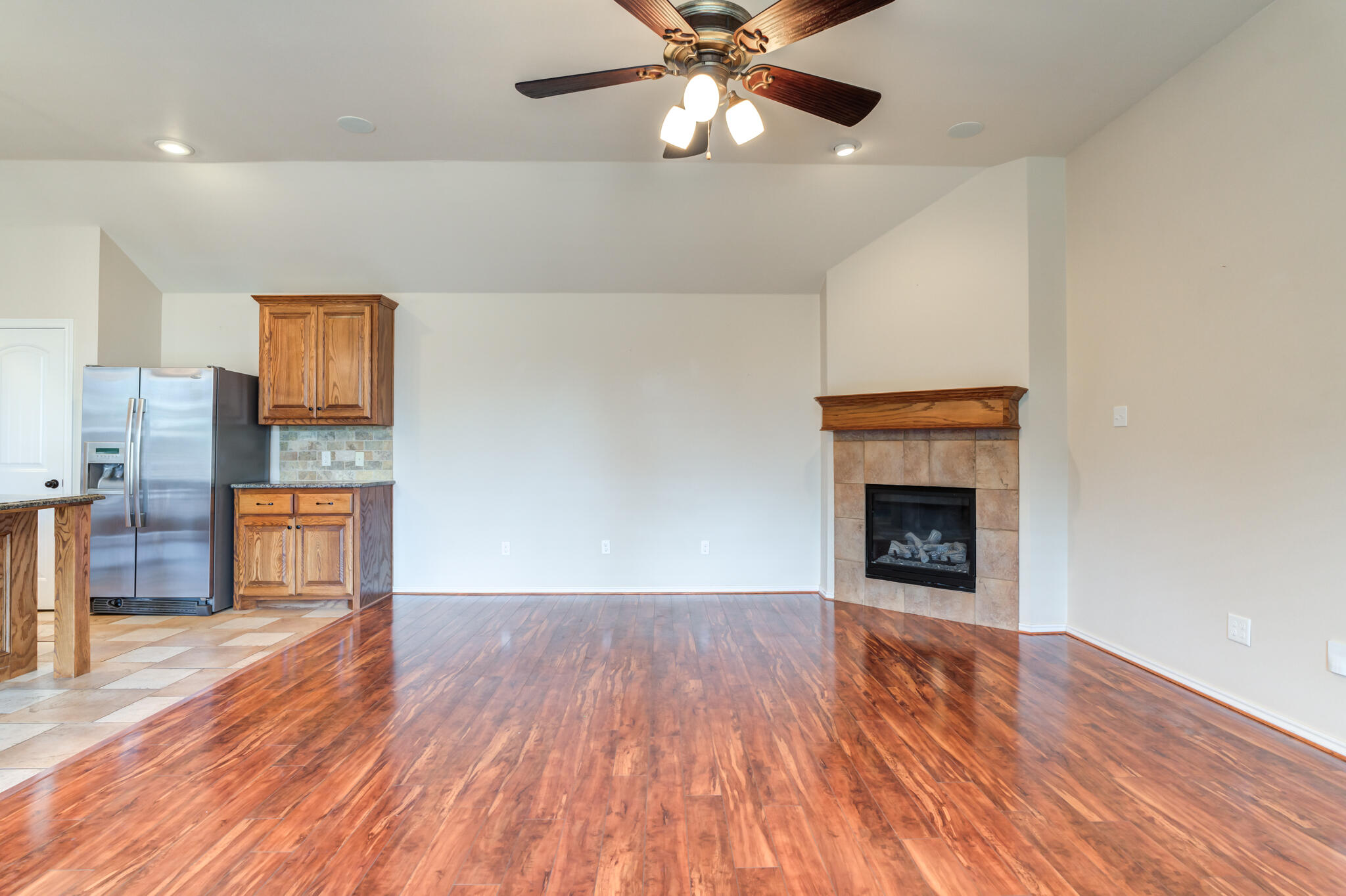 4802 Amherst Street Lubbock, TX 79416 - Photo 6 of 33 a view of an empty room and wooden floor