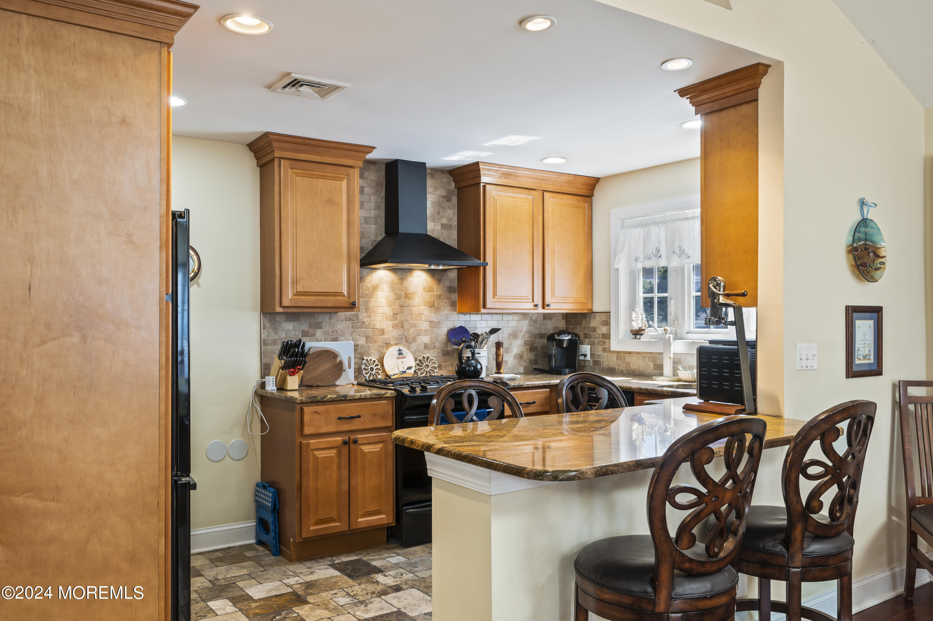 204 Randall Avenue Point Pleasant Beach, NJ 08742 - Photo 14 of 29 a kitchen with sink a stove and chairs