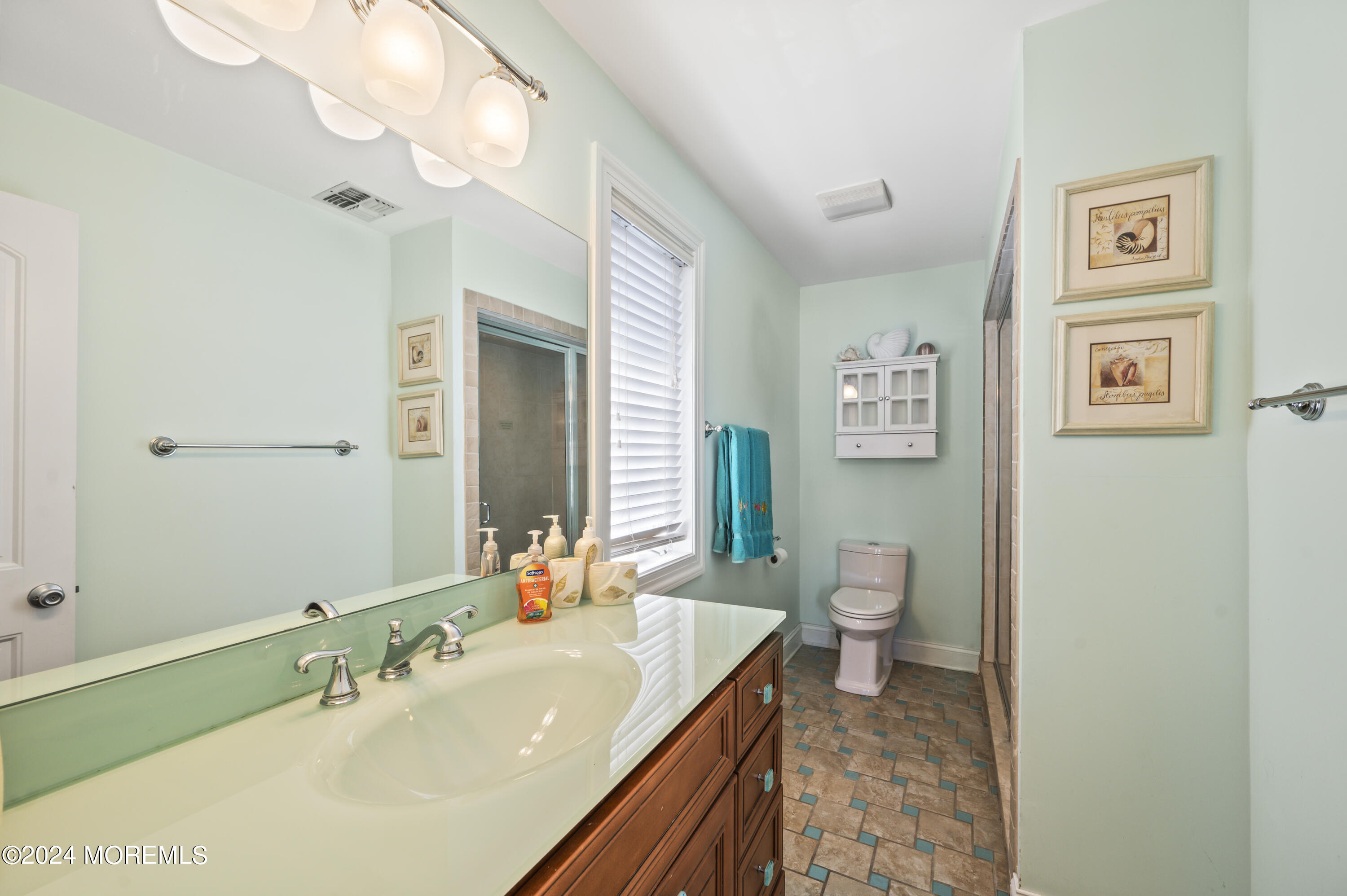 204 Randall Avenue Point Pleasant Beach, NJ 08742 - Photo 19 of 29 a bathroom with a granite countertop sink a toilet and mirror