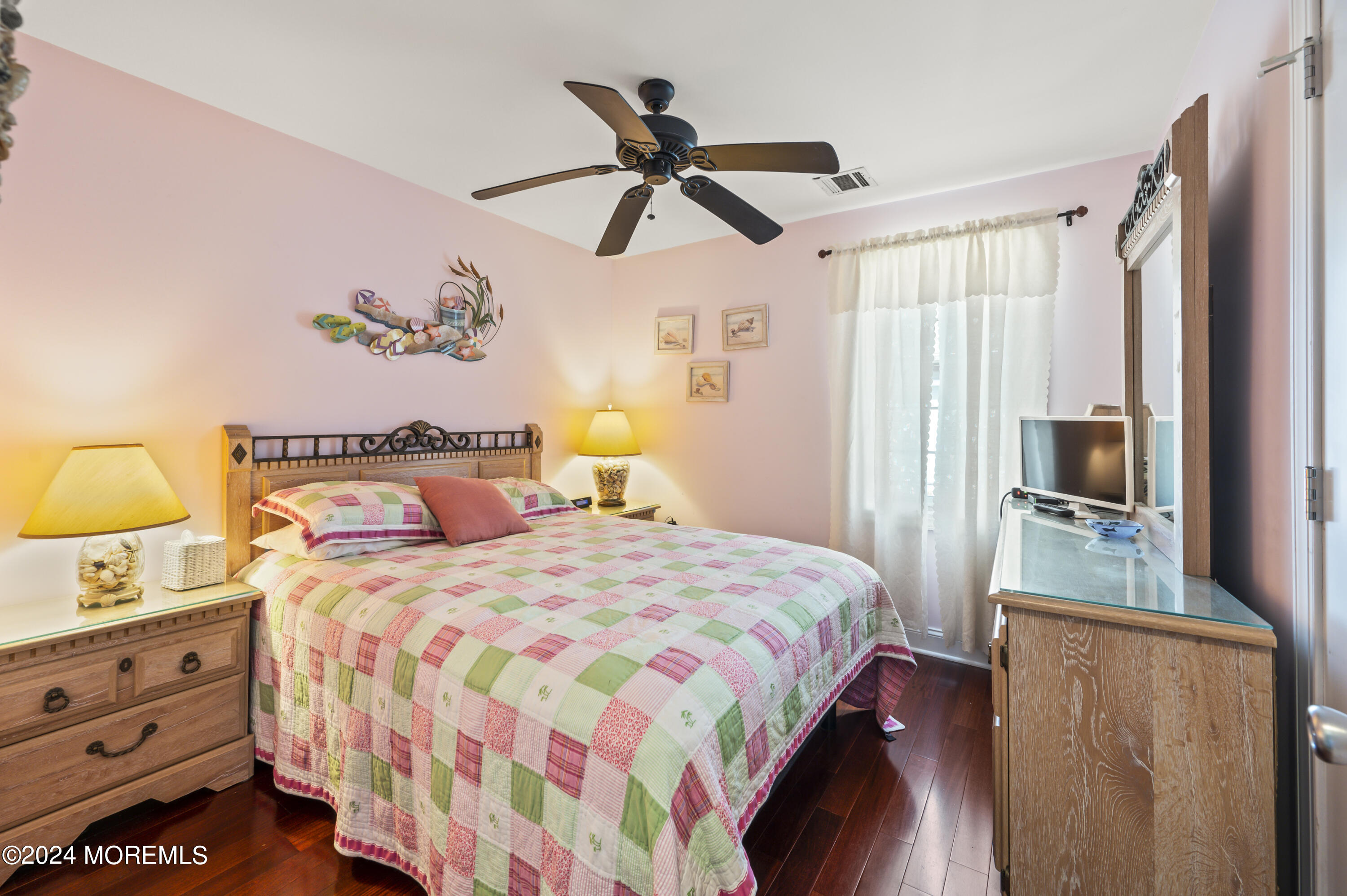 204 Randall Avenue Point Pleasant Beach, NJ 08742 - Photo 23 of 29 a bedroom with a bed and a chandelier