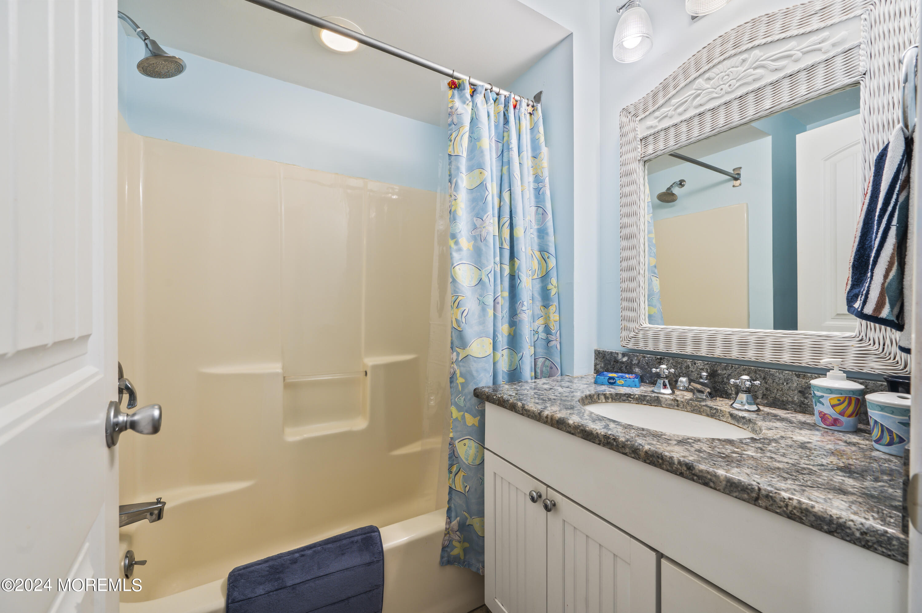 204 Randall Avenue Point Pleasant Beach, NJ 08742 - Photo 24 of 29 a bathroom with a granite countertop sink a mirror and a shower