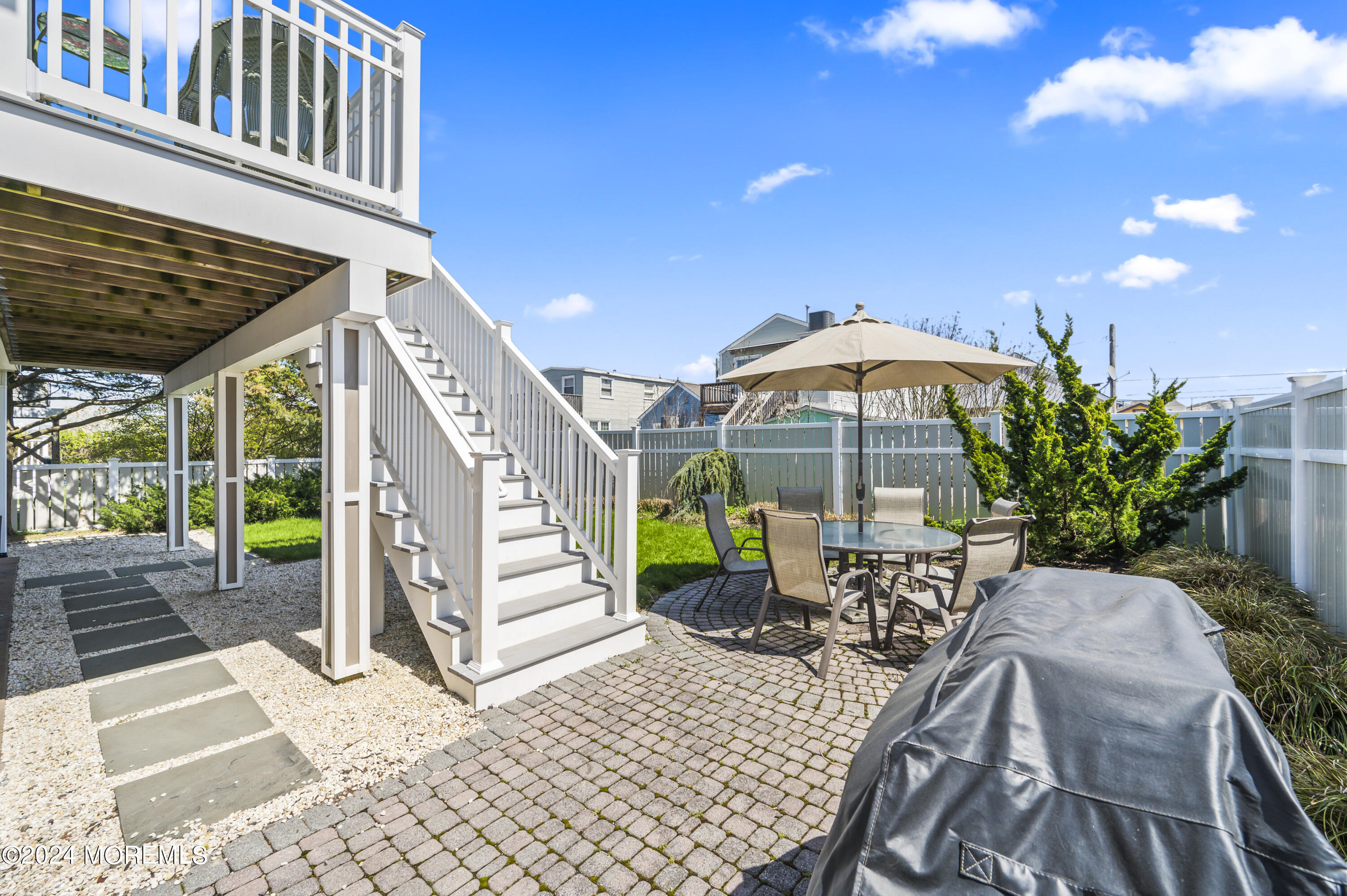 204 Randall Avenue Point Pleasant Beach, NJ 08742 - Photo 3 of 29 a view of a patio with a table and chairs