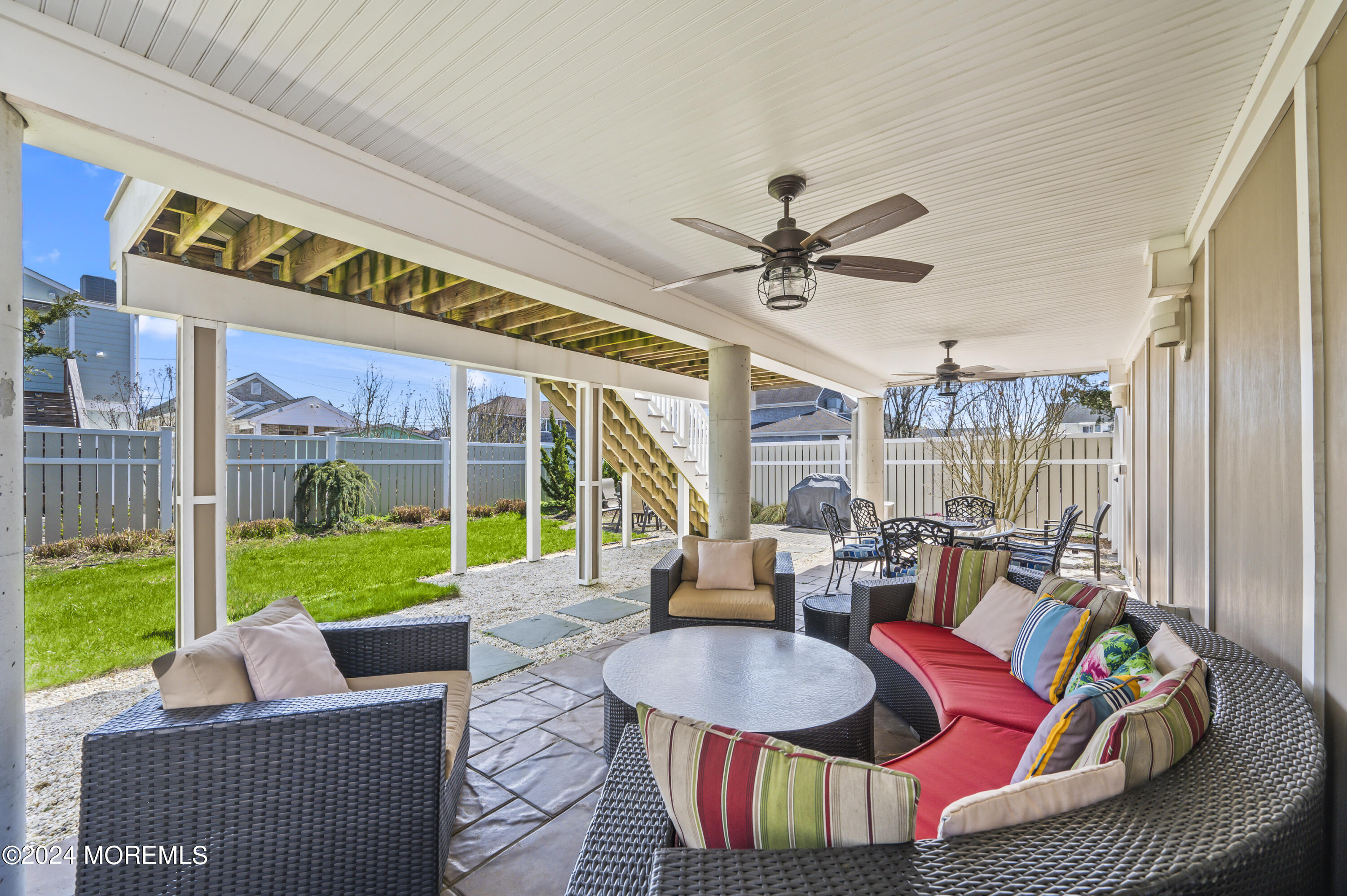 204 Randall Avenue Point Pleasant Beach, NJ 08742 - Photo 5 of 29 a living room with patio furniture and a garden